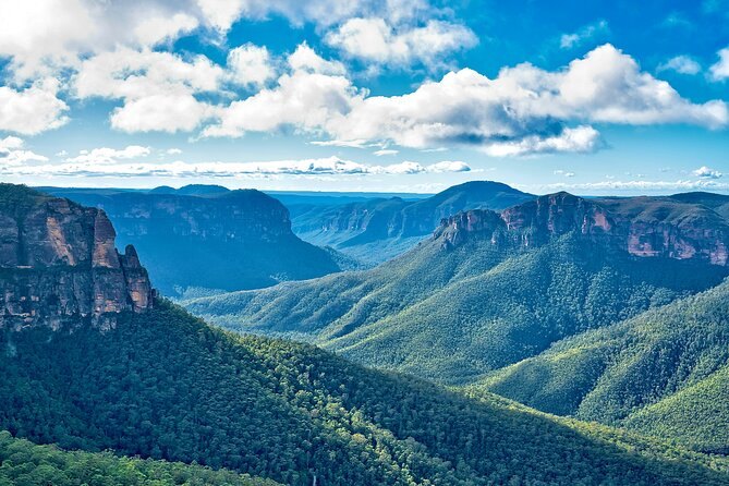 The valley seen from a clifftop lookout, ridgelines running to the horizon